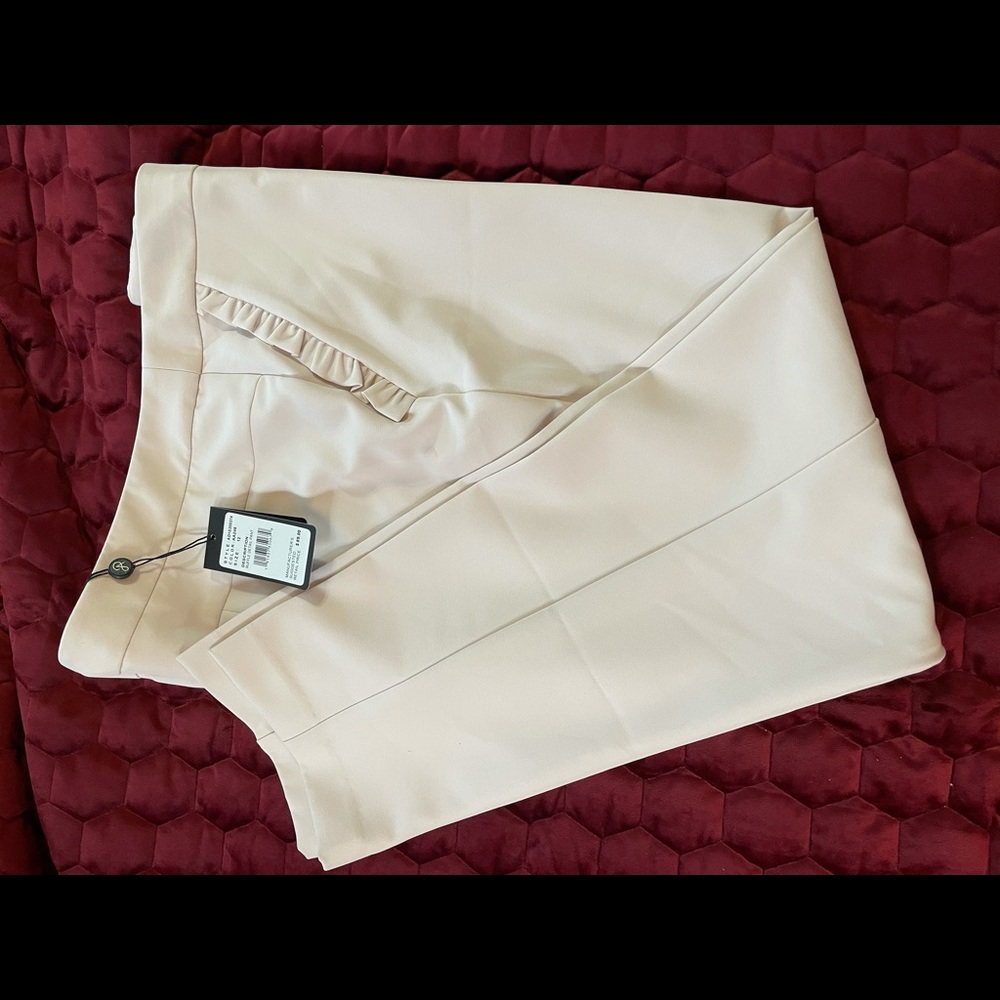 Powder pink dress pant w/ ruffle detail